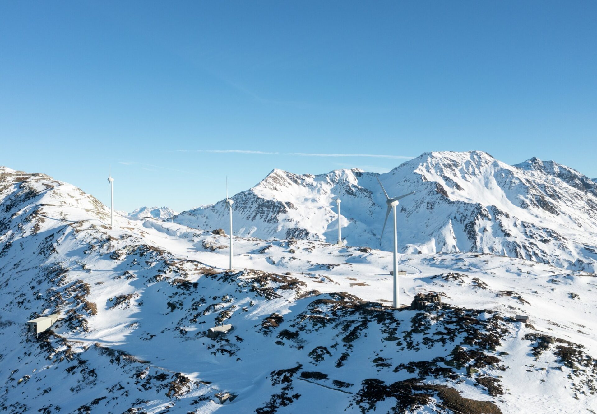 wind farm in snowy mountains